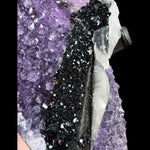 Close Up of  Hematite Crystals on Calcite Crystals atop Amethyst Crystals