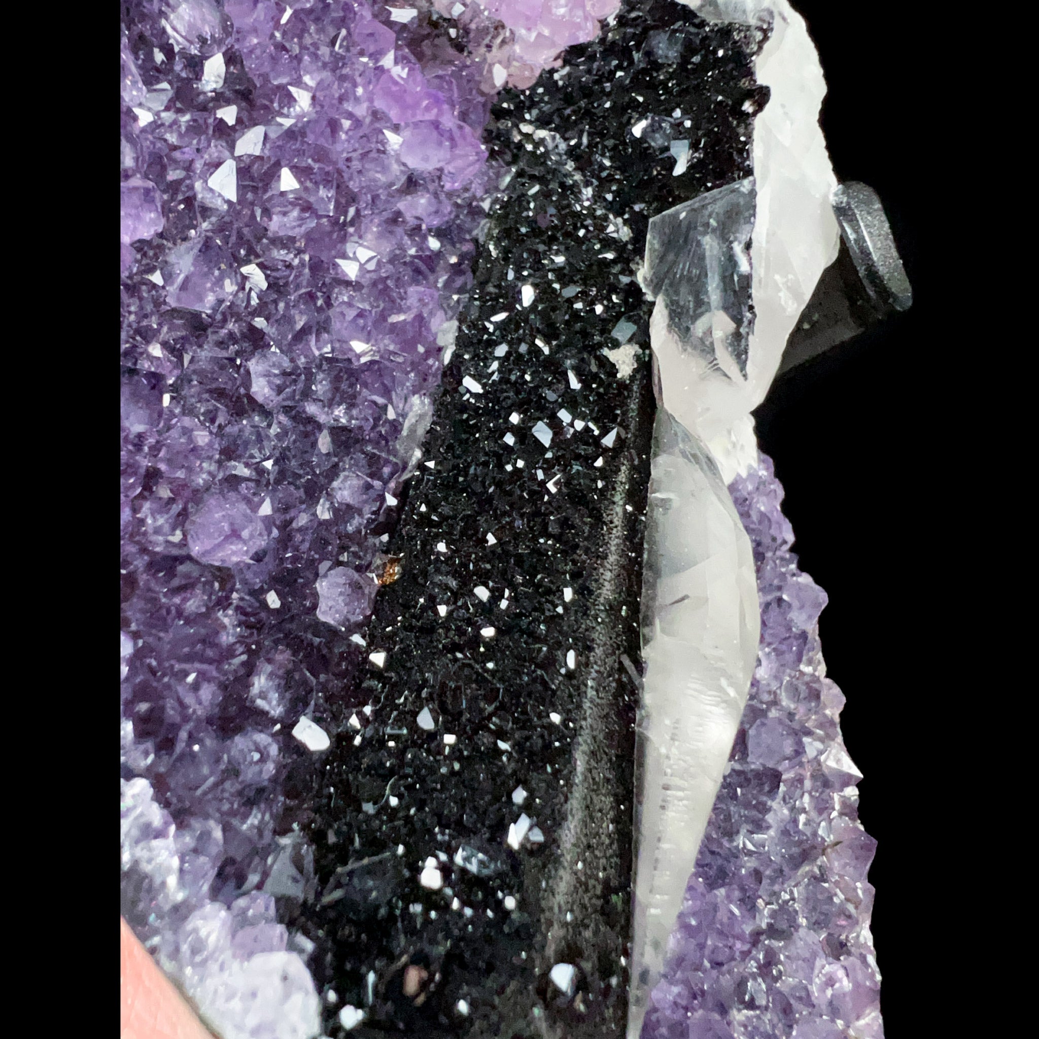Close Up of  Hematite Crystals on Calcite Crystals atop Amethyst Crystals