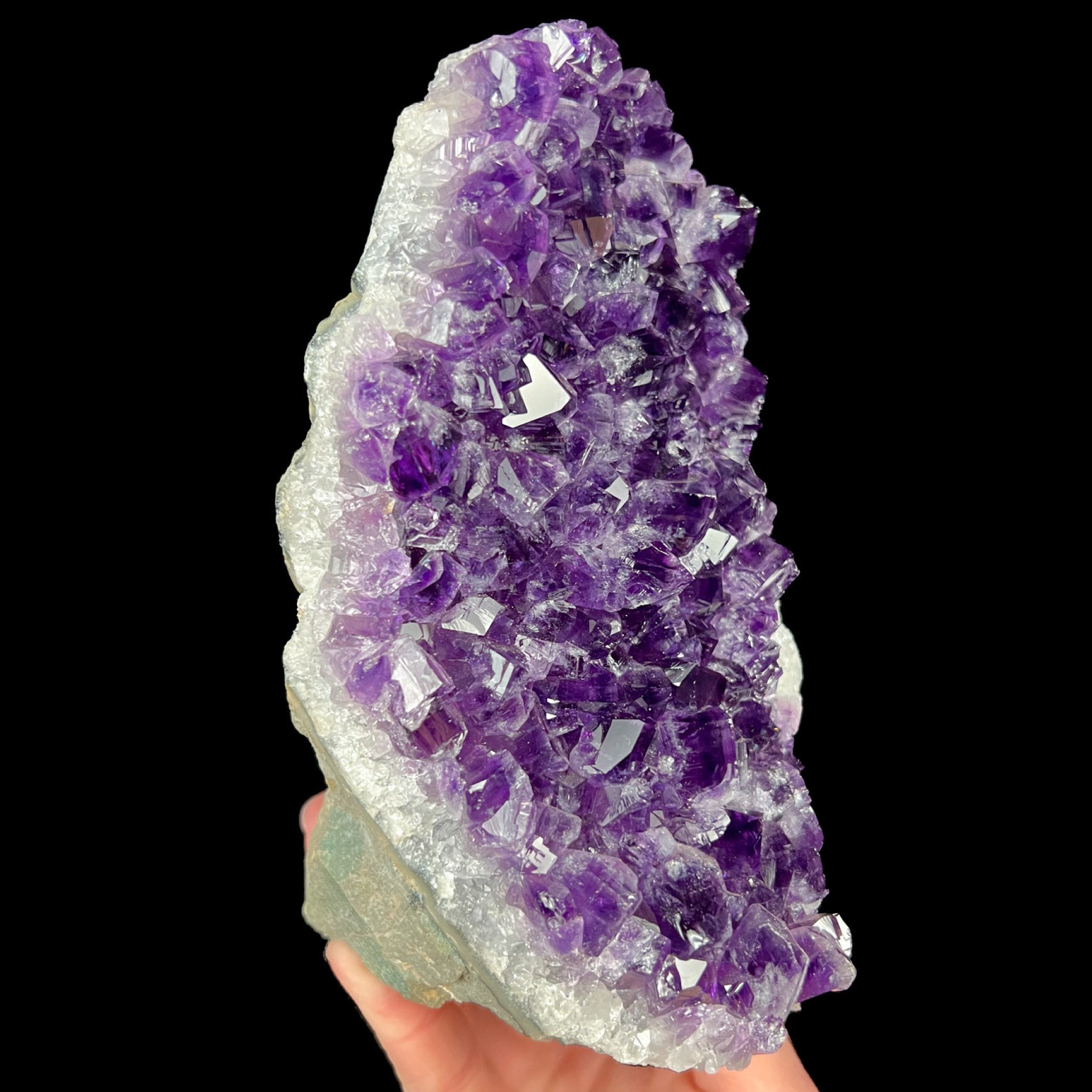 Amethyst crystal cluster with flat cut base