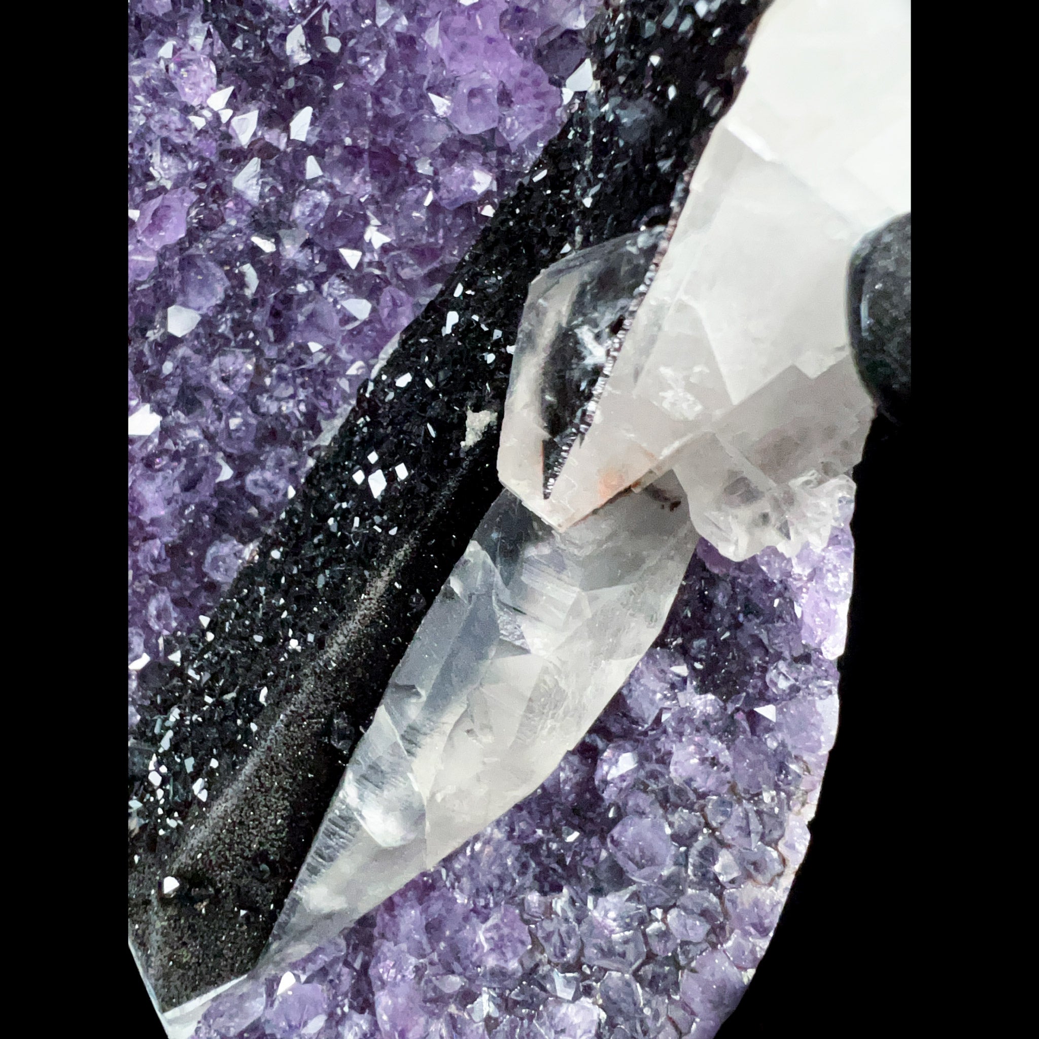 Close Up of Black Hematite Crystals with White Calcite Crystals on Purple Amethyst Crystals