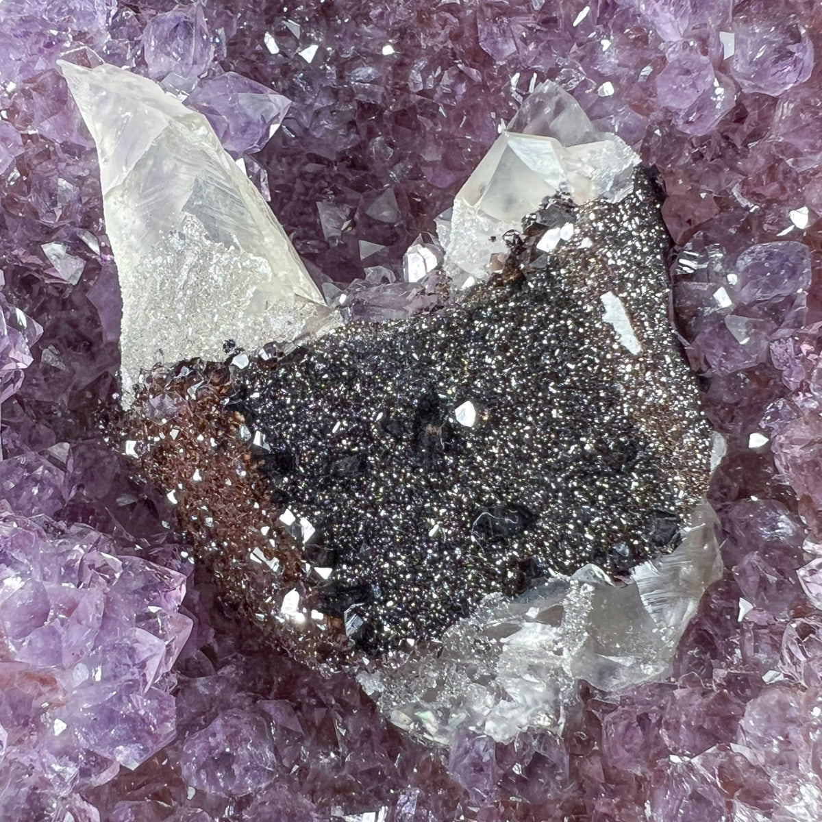Amethyst Geode with Calcite and Hematite Crystals