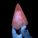 Calcite crystal displaying UV fluorescence
