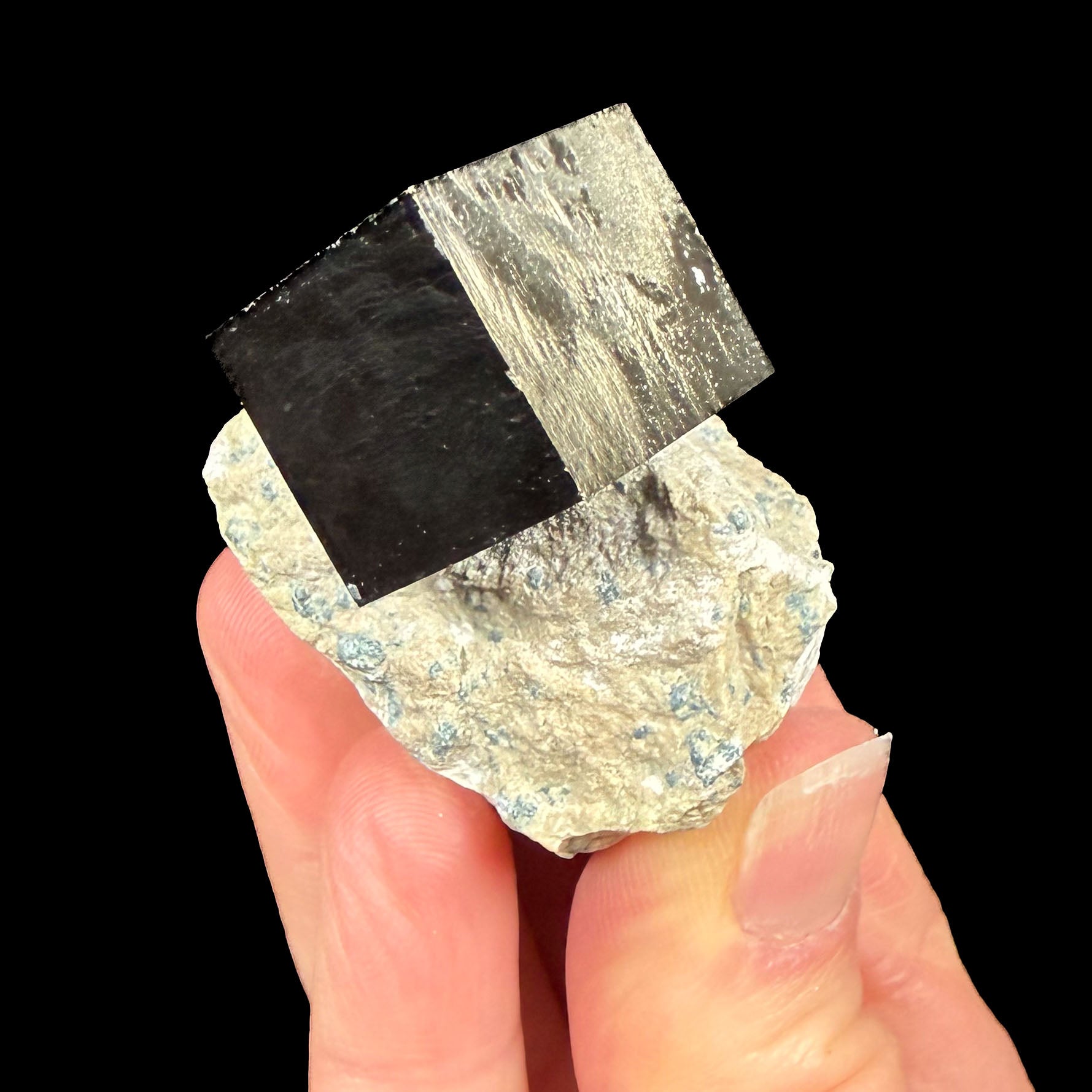Pyrite crystal cube in limestone matrix