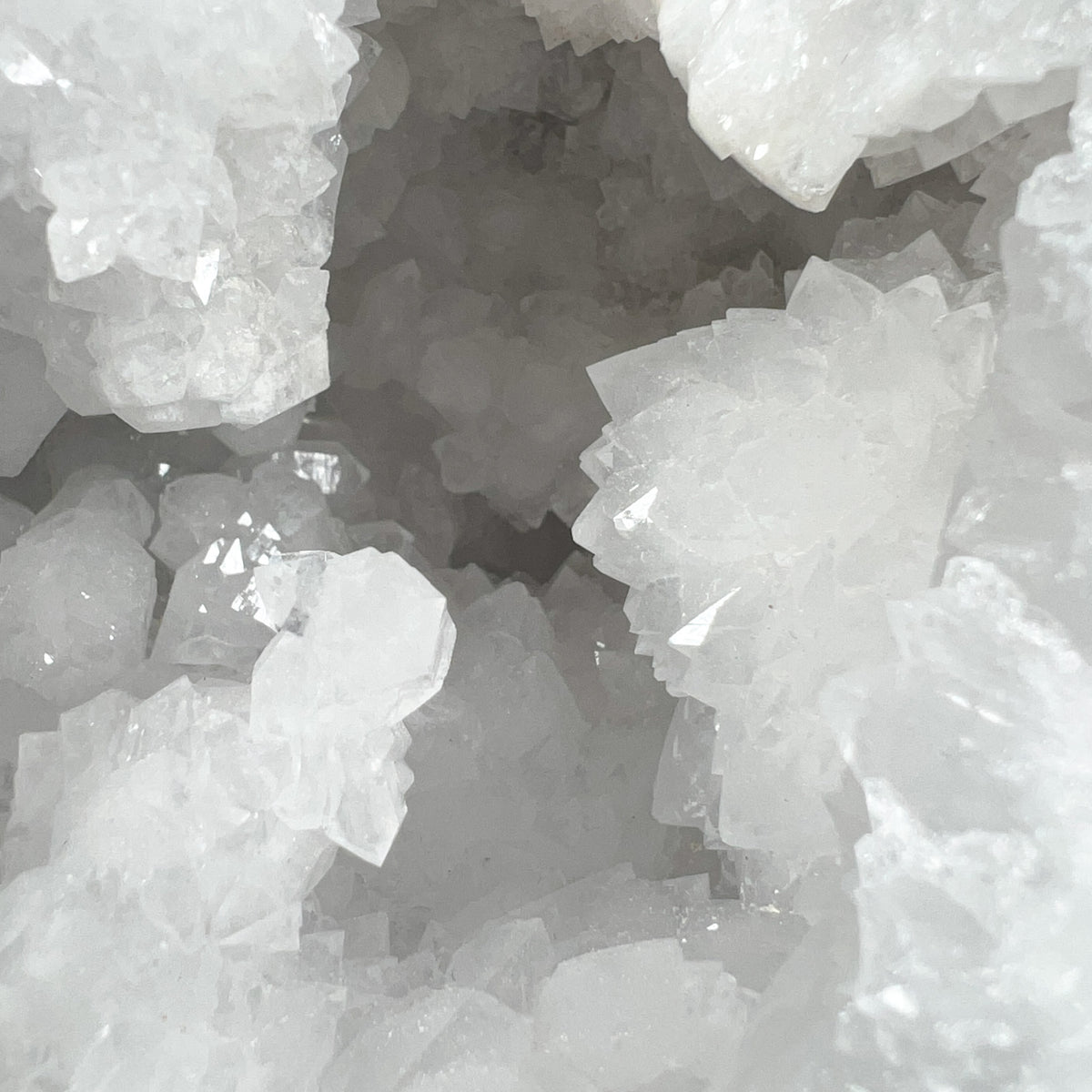 Close-up of White Quartz Crystal Clusters Inside a Geode