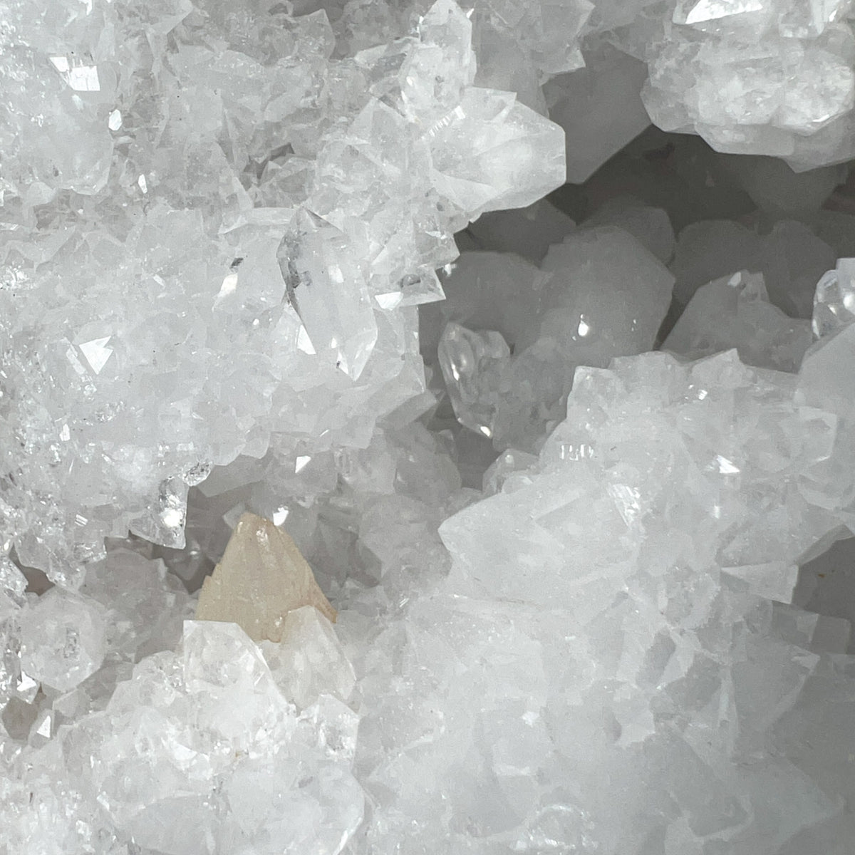Quartz Crystals with small Calcite Crystal on Bottom Left