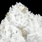 Close up of white Quartz crystals and golden Pyrite crystals
