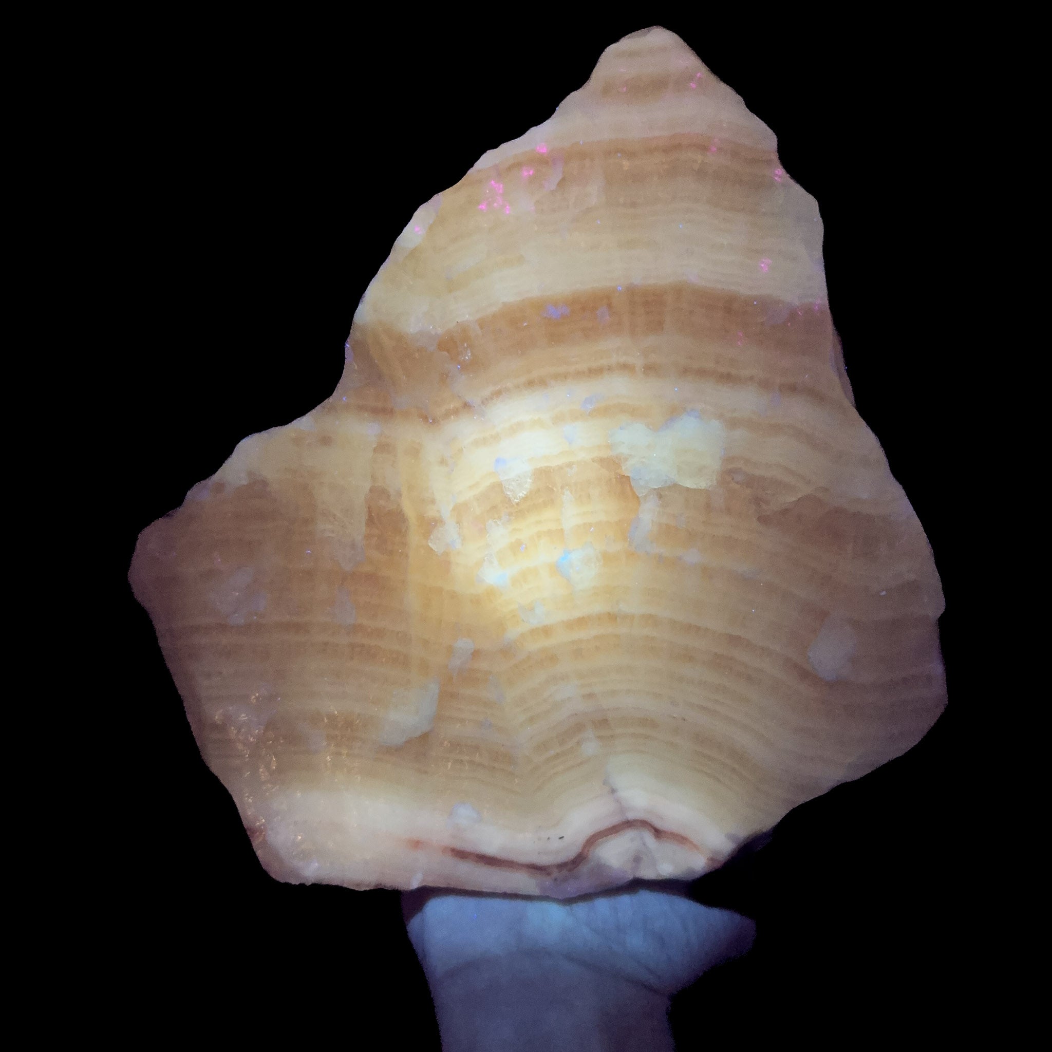 Calcite specimen from Mexico displaying UV fluorescence