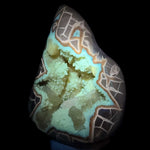 Calcite concretion under UV light displaying fluorescence