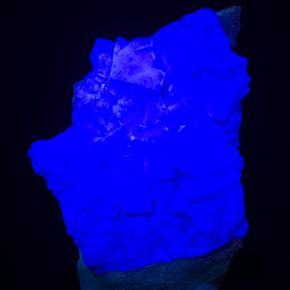 Fluorite Specimen shown reacting under Ultra Violet flashlight