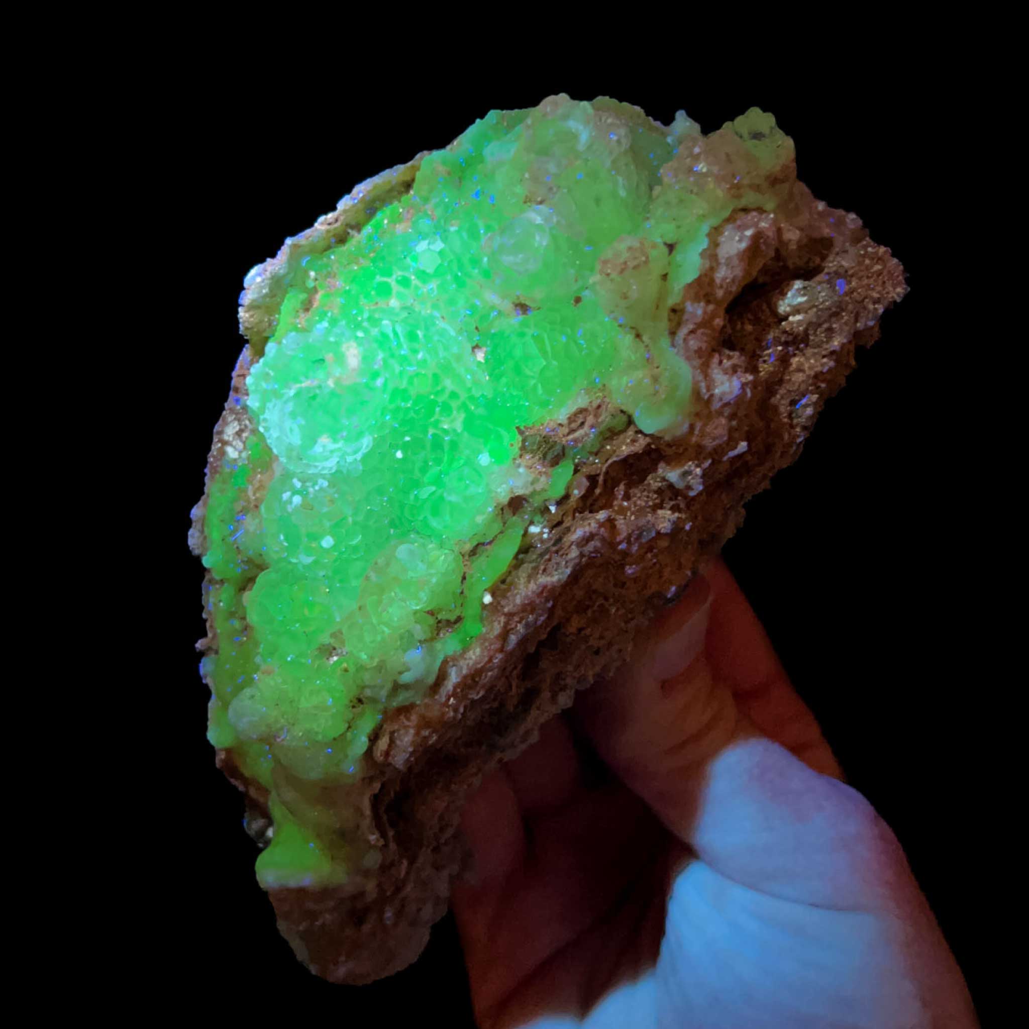 Hyalite Opal mineral specimen displaying green UV fluorescence