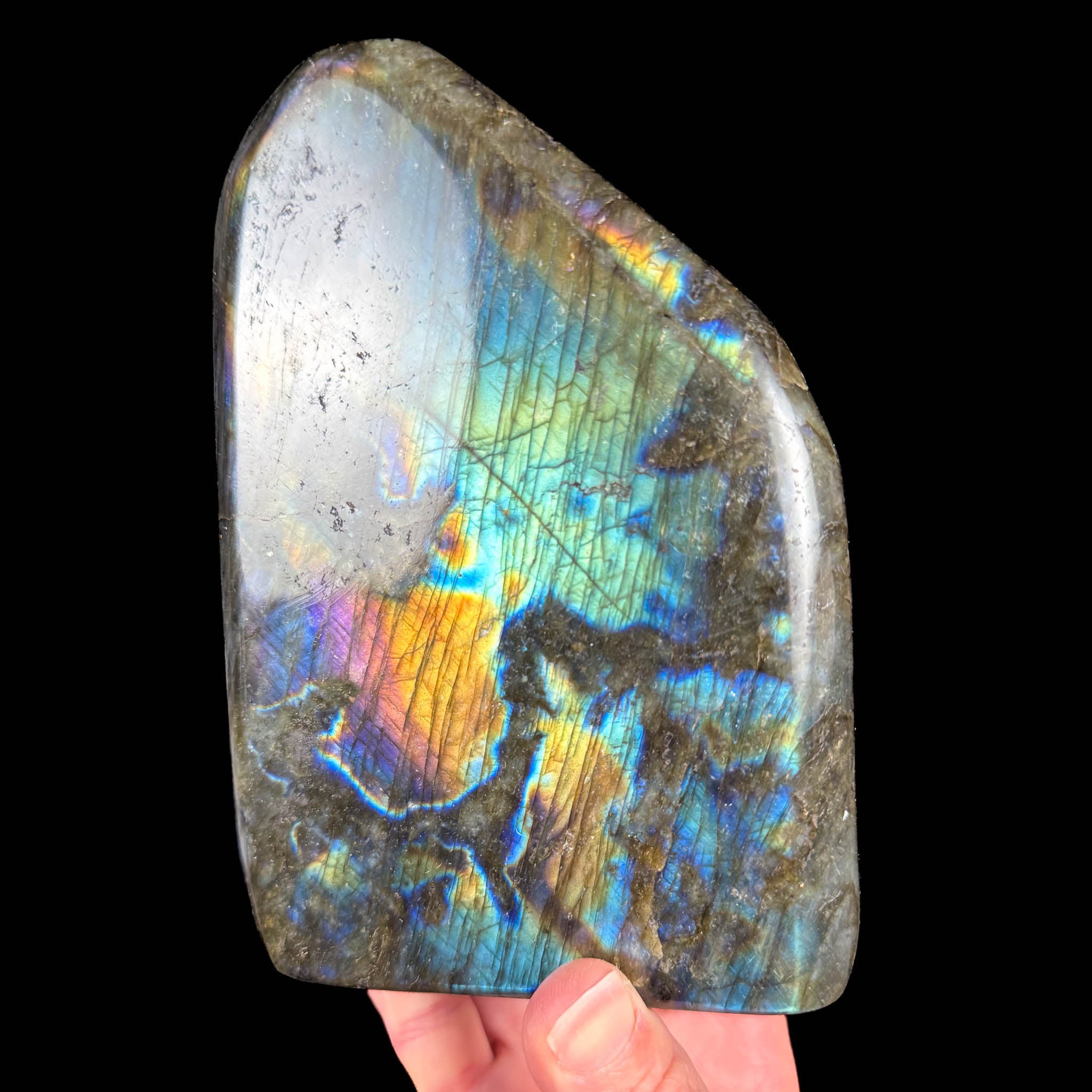 Large polished Labradorite stone with a rainbow color flash
