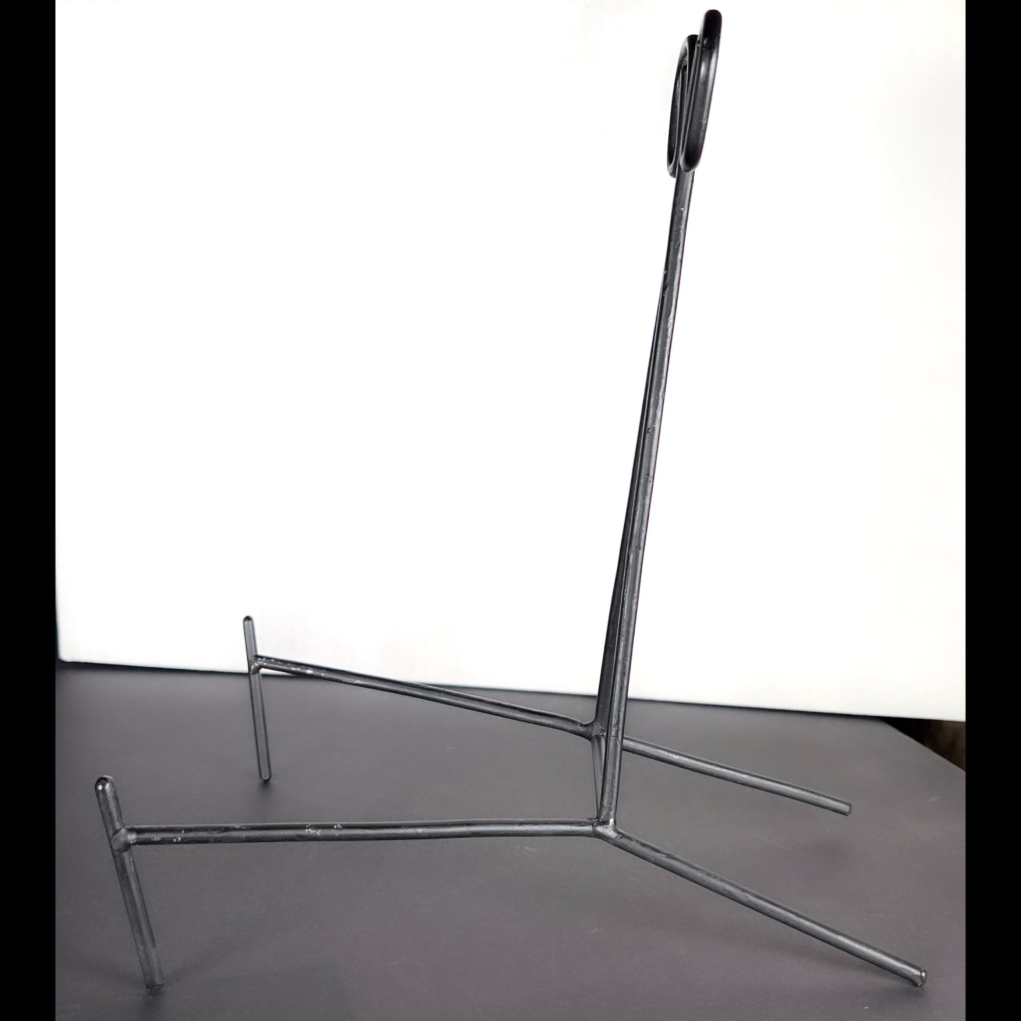 Large Black Metal Display Stand with Scroll Top