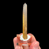 A natural raw golden yellow Citrine crystal point which has not been treated or heated to alter the color. 