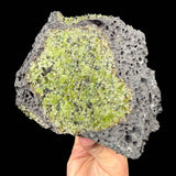 Peridot crystals in basalt rock matrix
