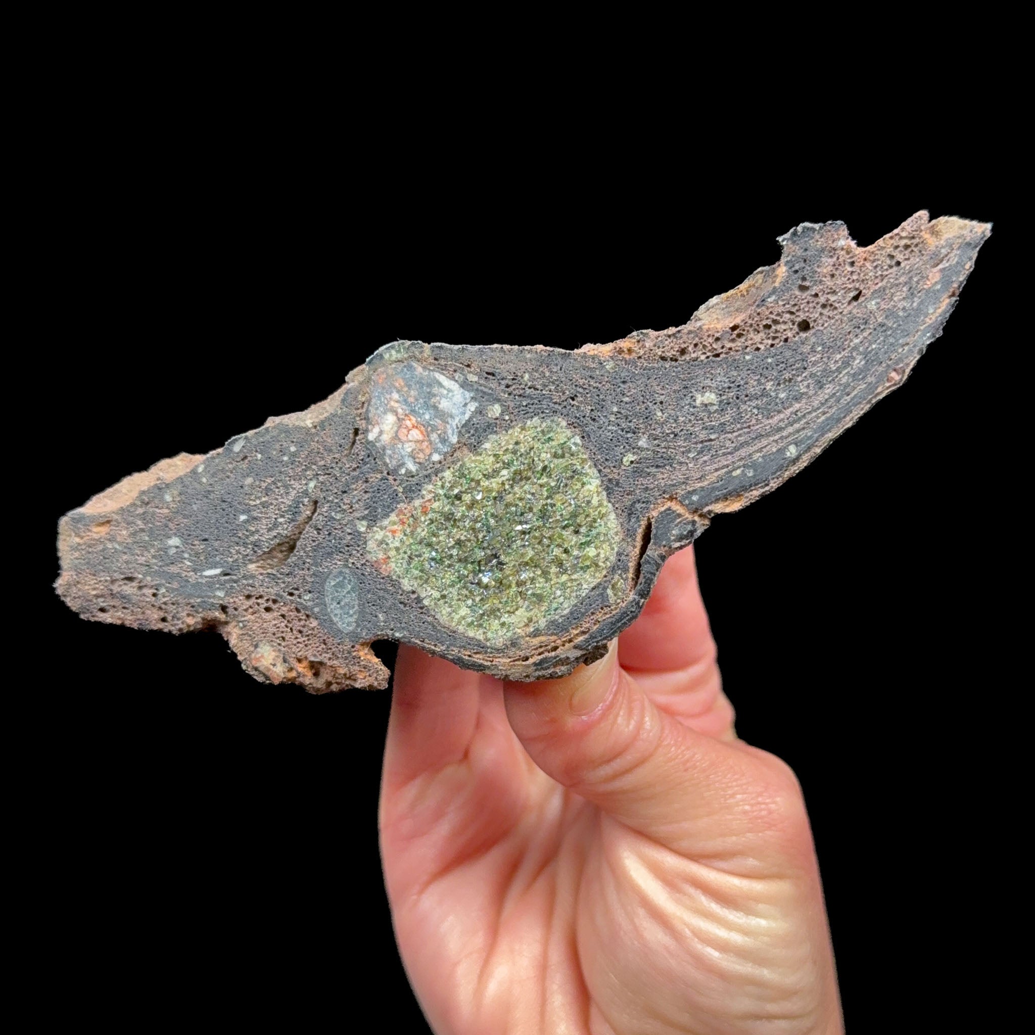 Gabbro and Olivine / Peridot crystals inside a volcanic bomb mineral specimen from Spain