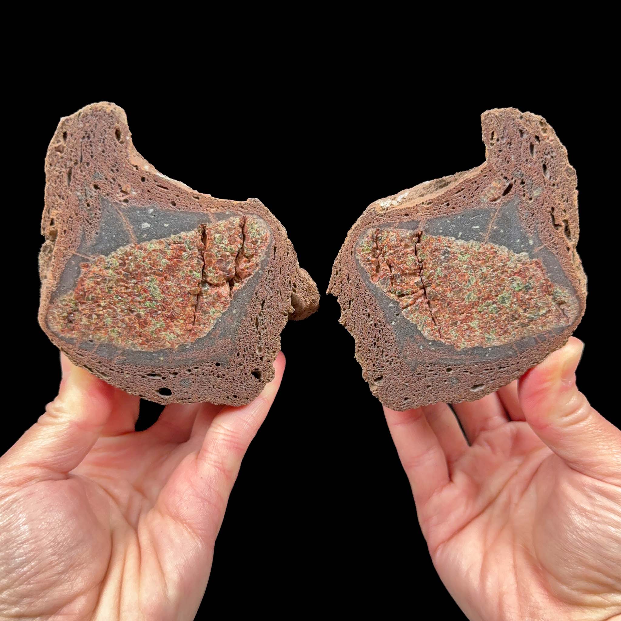 Two halves of volcanic bomb from Llémena Valley, Girona Province, Catalonia, Spain