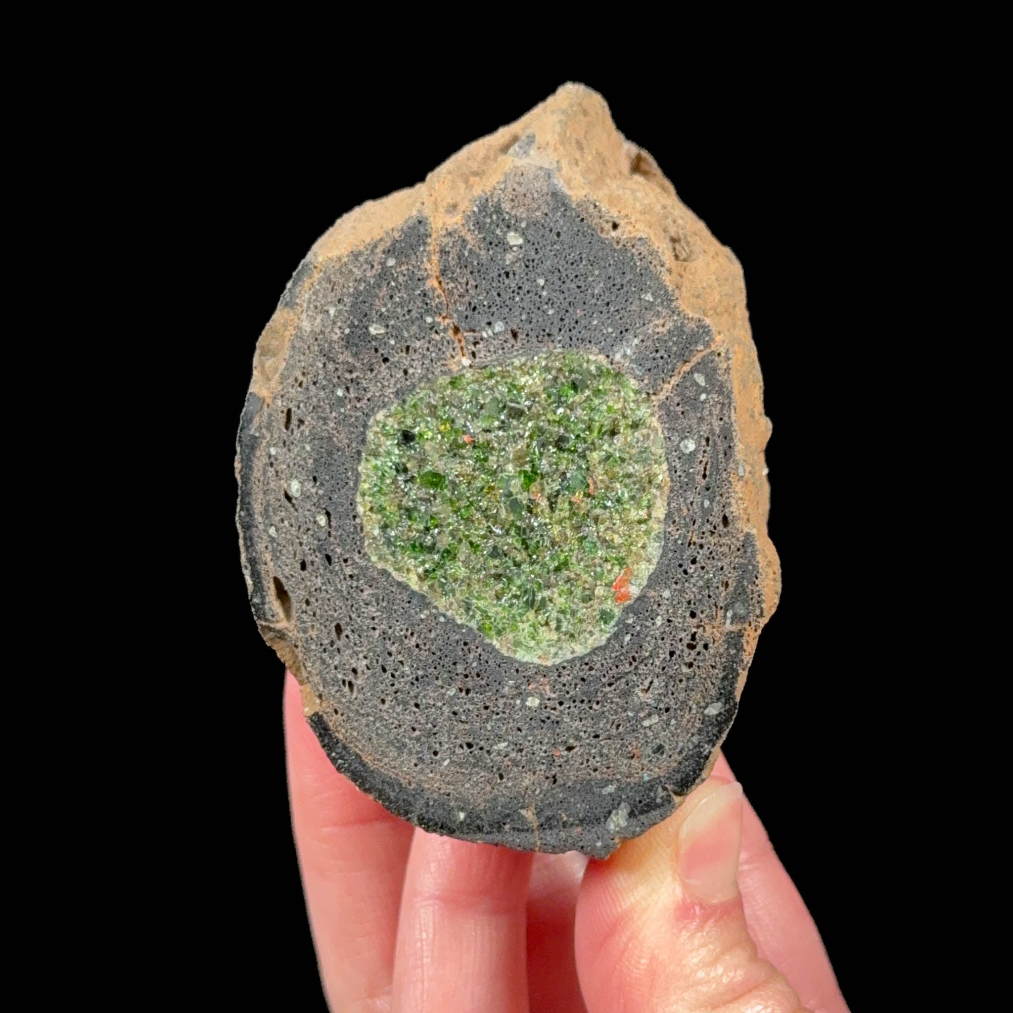 Olivine / Peridot crystals inside a volcanic bomb specimen from Spain