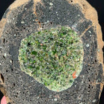 Close up of Olivine and Peridot crystals inside a volcanic bomb