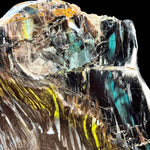 Close up of Chrysocolla and Volborthite inclusions in Petrified Wood from Turkey