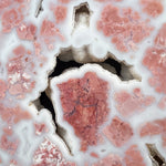 Close up of Quartz crystal pockets inside pink Agate stone from Mexico