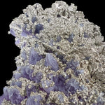 Natural mineralization of Pyrite on top of Amethyst crystals