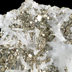 Close up of cubic Pyrite crystals with Quartz points from Peru