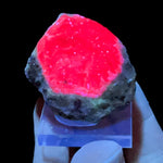 Ruby with Zoisite Displaying UV fluorescence 