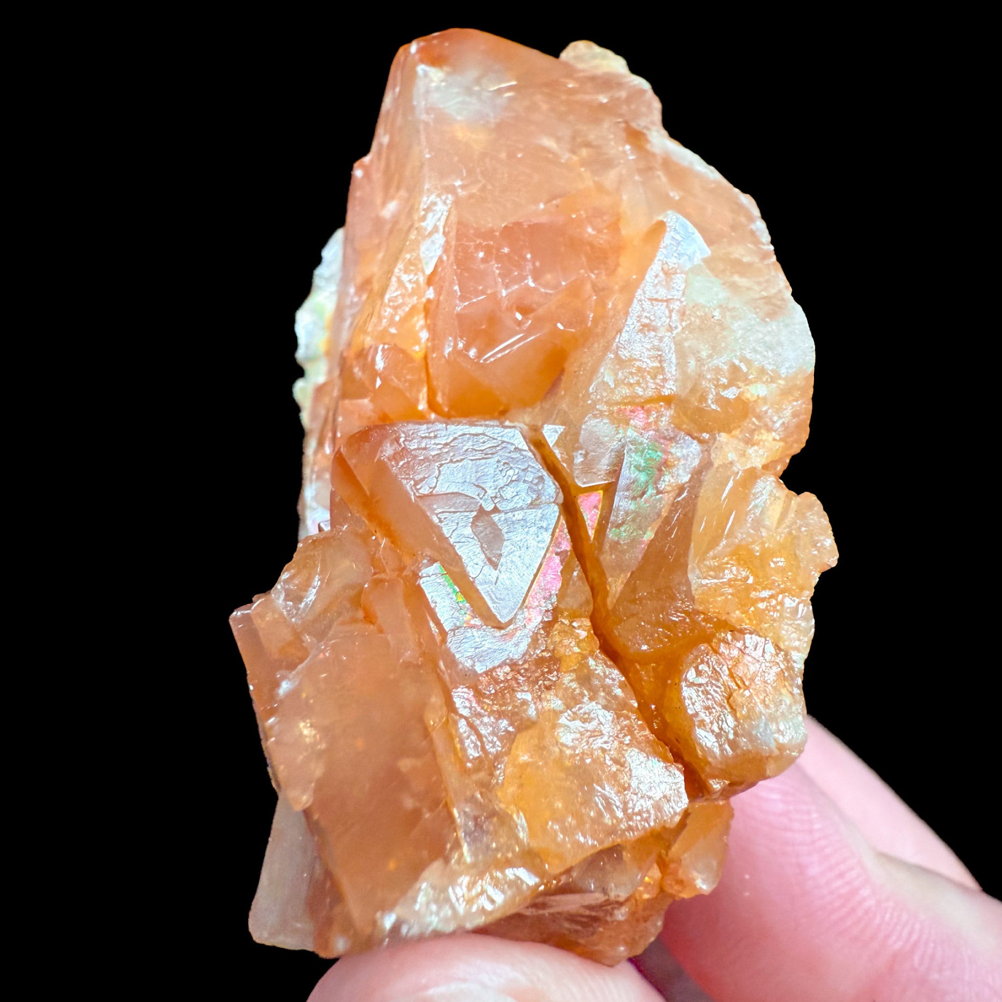 Iridescence on orange Scheelite crystals