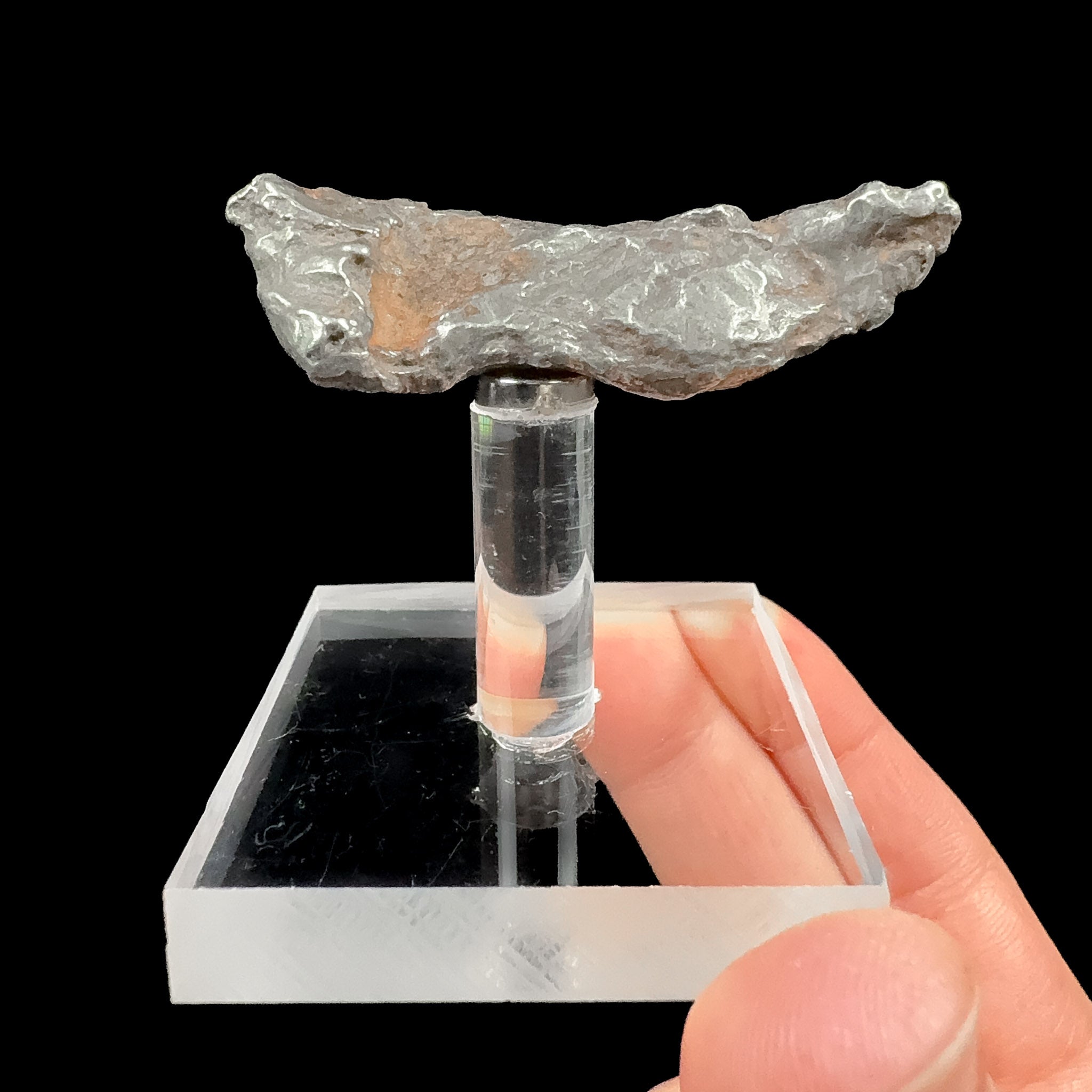 Sikhote Alin Meteorite specimen on magnetic display stand