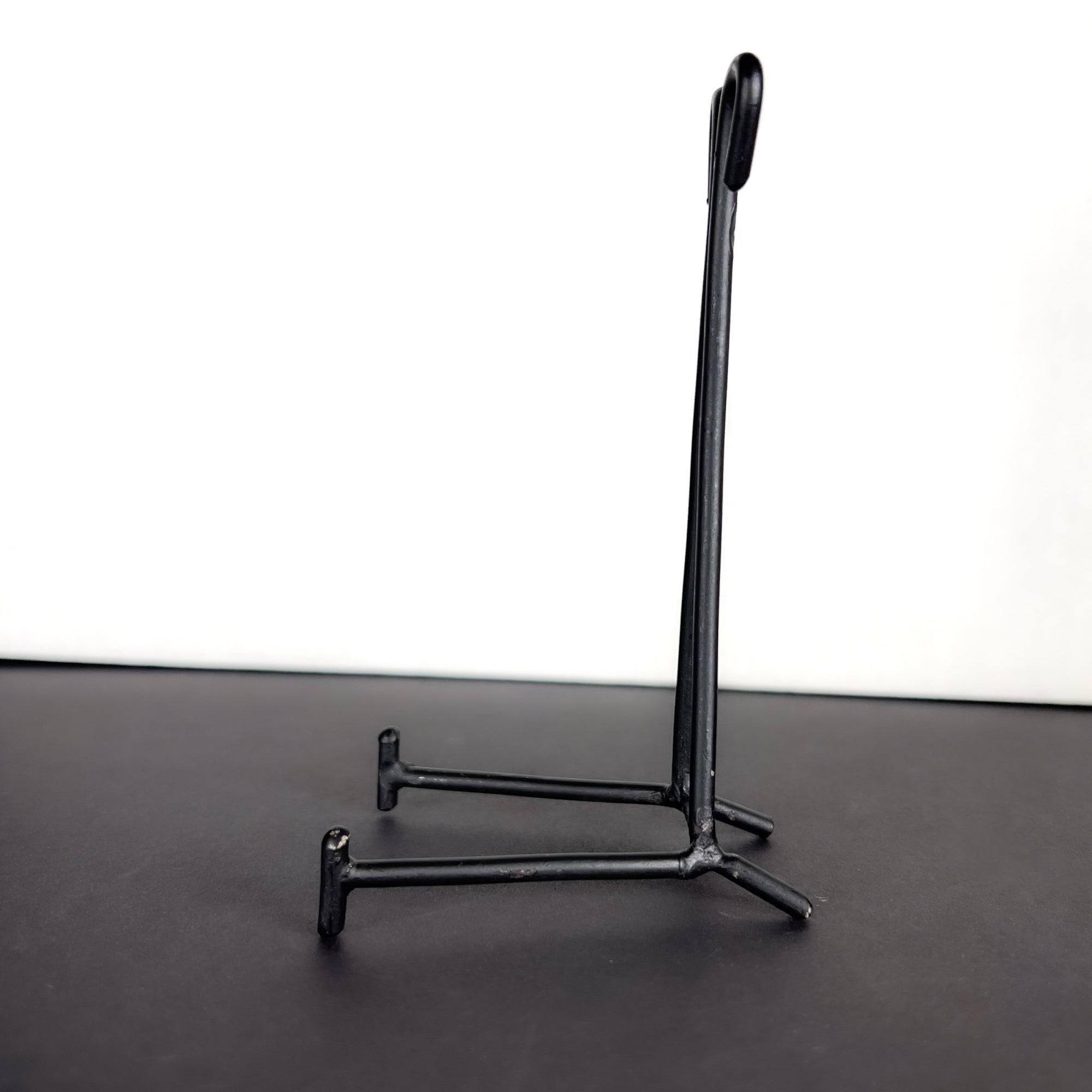 Small Black Metal Display Stand with Scroll Top
