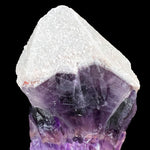 Close Up of White Quartz on top of Purple Amethyst Crystal