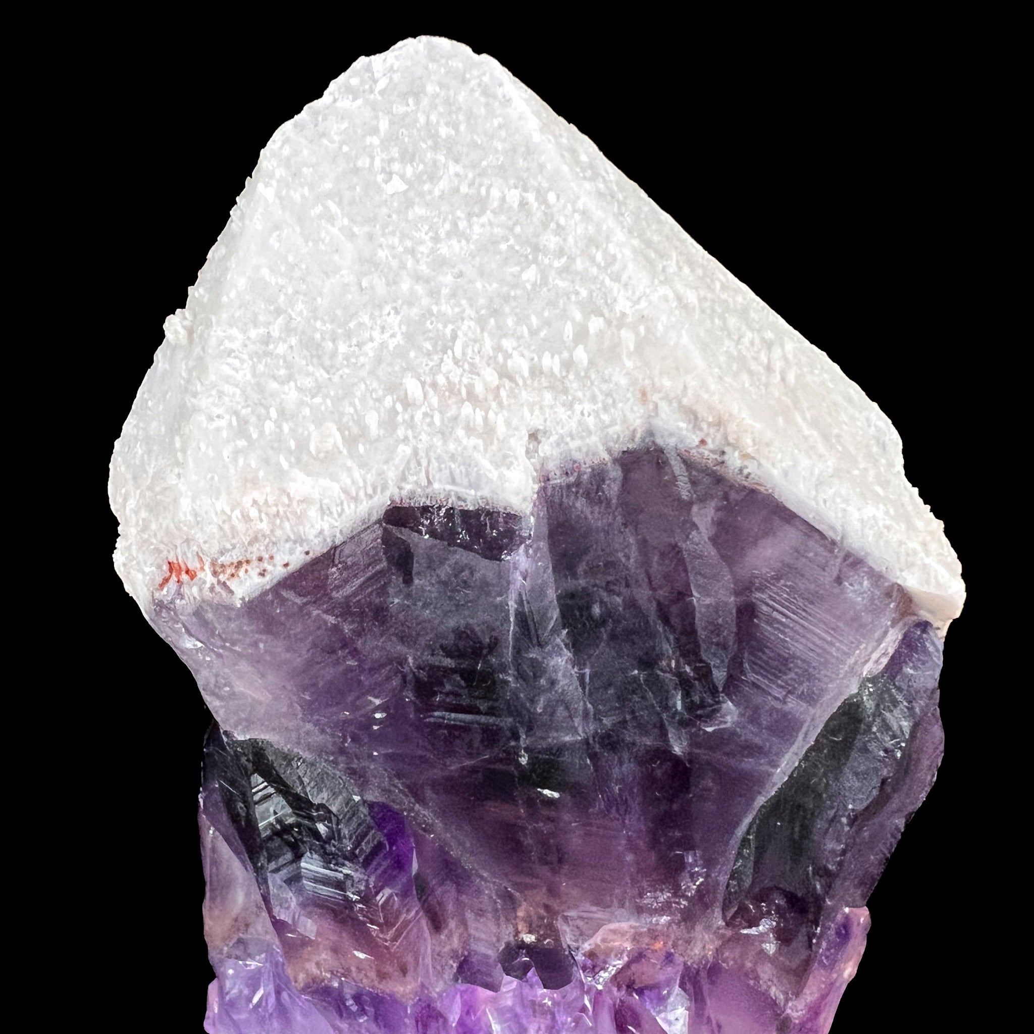 Close Up of White Quartz on top of Purple Amethyst Crystal