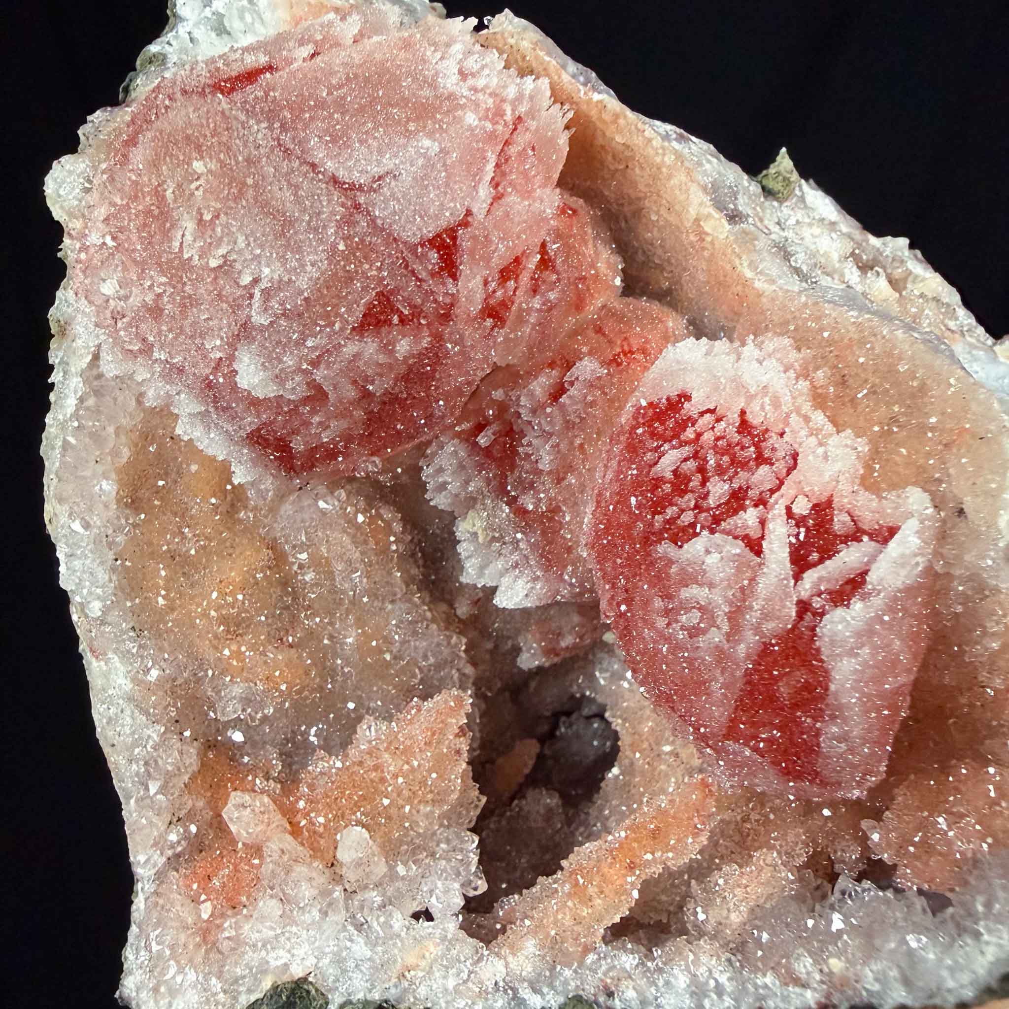 close up of drusy quartz crystals coating calcite crystals