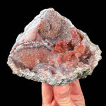 Red quartz crystals inside a geode from Morocco