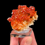 Red orange crystals of Vanadinite on white Barite crystals