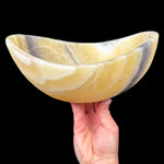 Polished yellow and zebra calcite bowl from Mexico