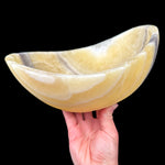 Oval-shaped polished stone calcite bowl