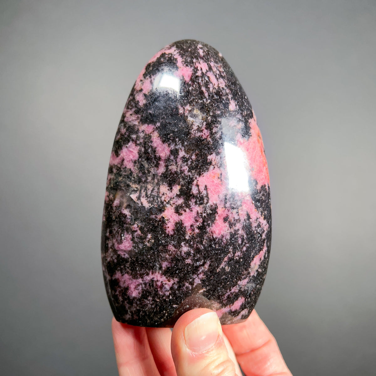 Polished Black and Pink Rhodonite Stone