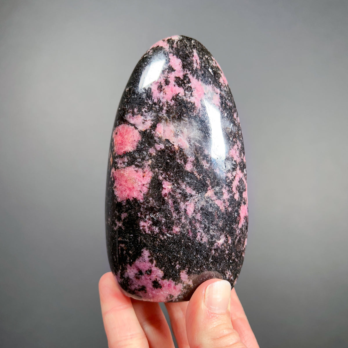 Polished Black and Pink Rhodonite Stone